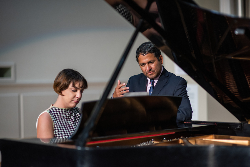 Dean Garcia with a student playing piano