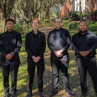 Students MiQuan Lamar, Gavin McNabb, Justin Bockstege and Victor Zayas posing otside