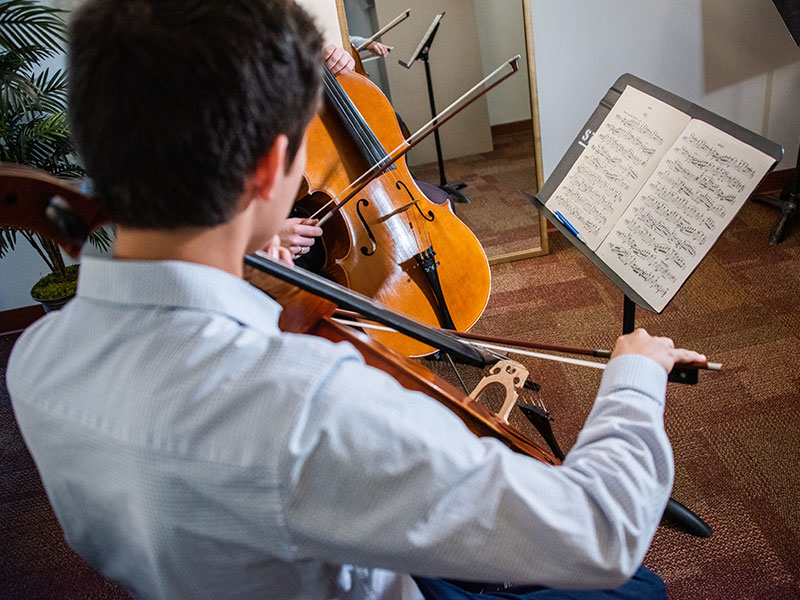 student playing instrument