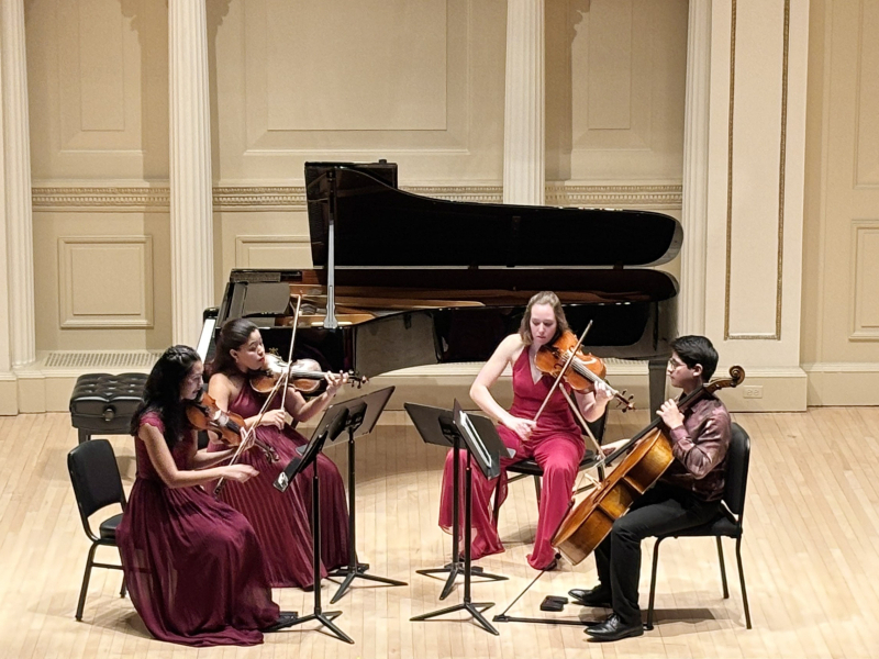 4 students playing string instruments