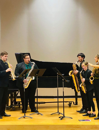 Saxophones players performing