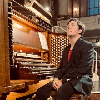  Joseph Parr sitting next to organ