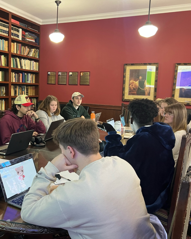 Students developing a game together for hatter games