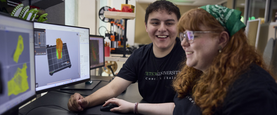 two students making a 3d model