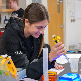 student working in a science lab
