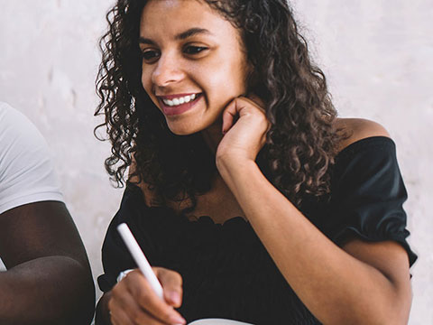 A woman assisting with the financial aid process.