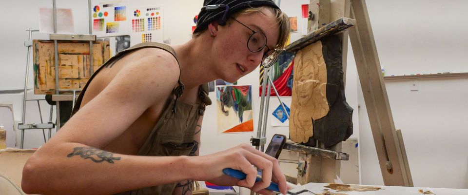 Art student painting on studio