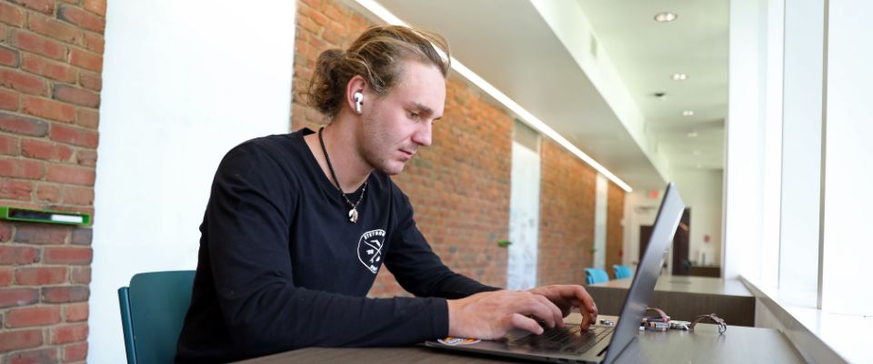 Computer Science student with computer