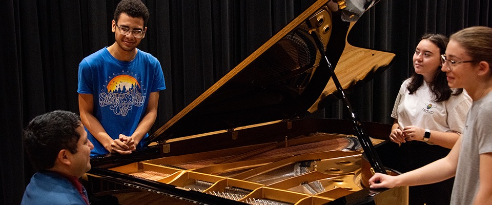 Students around piano