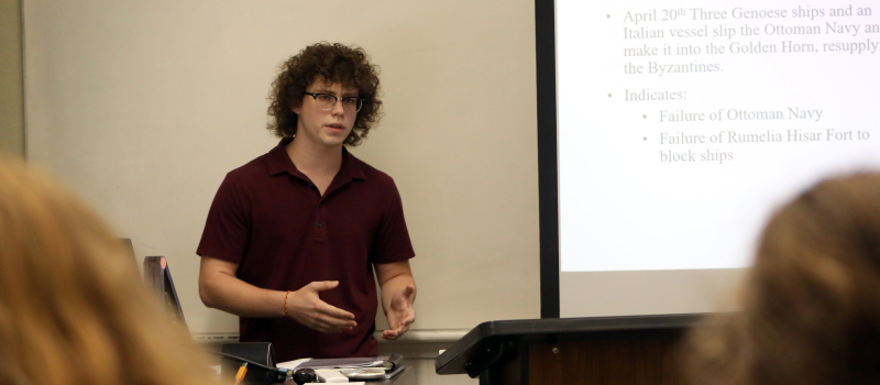 student giving a presentation during showcase