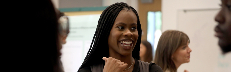 student talking to friends during showcase