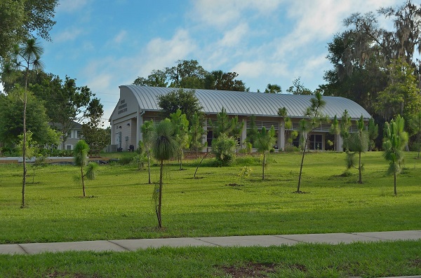 Rinker Environmental Learning Center amidst a young manicured green landscape