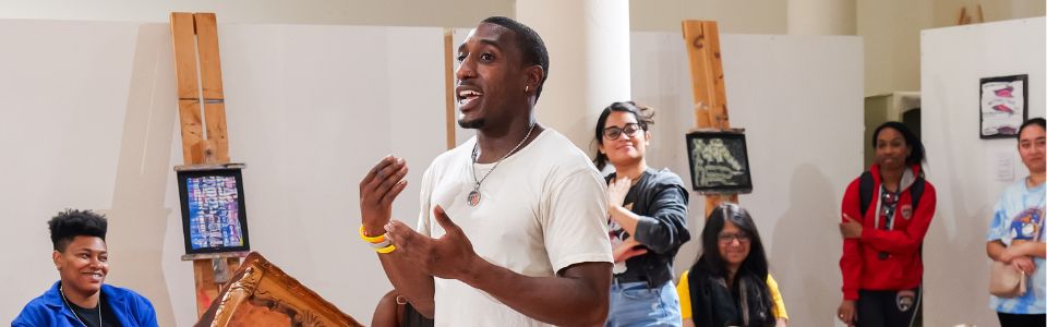 student presenting in front of group