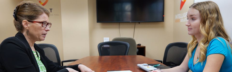 students and professor working on project