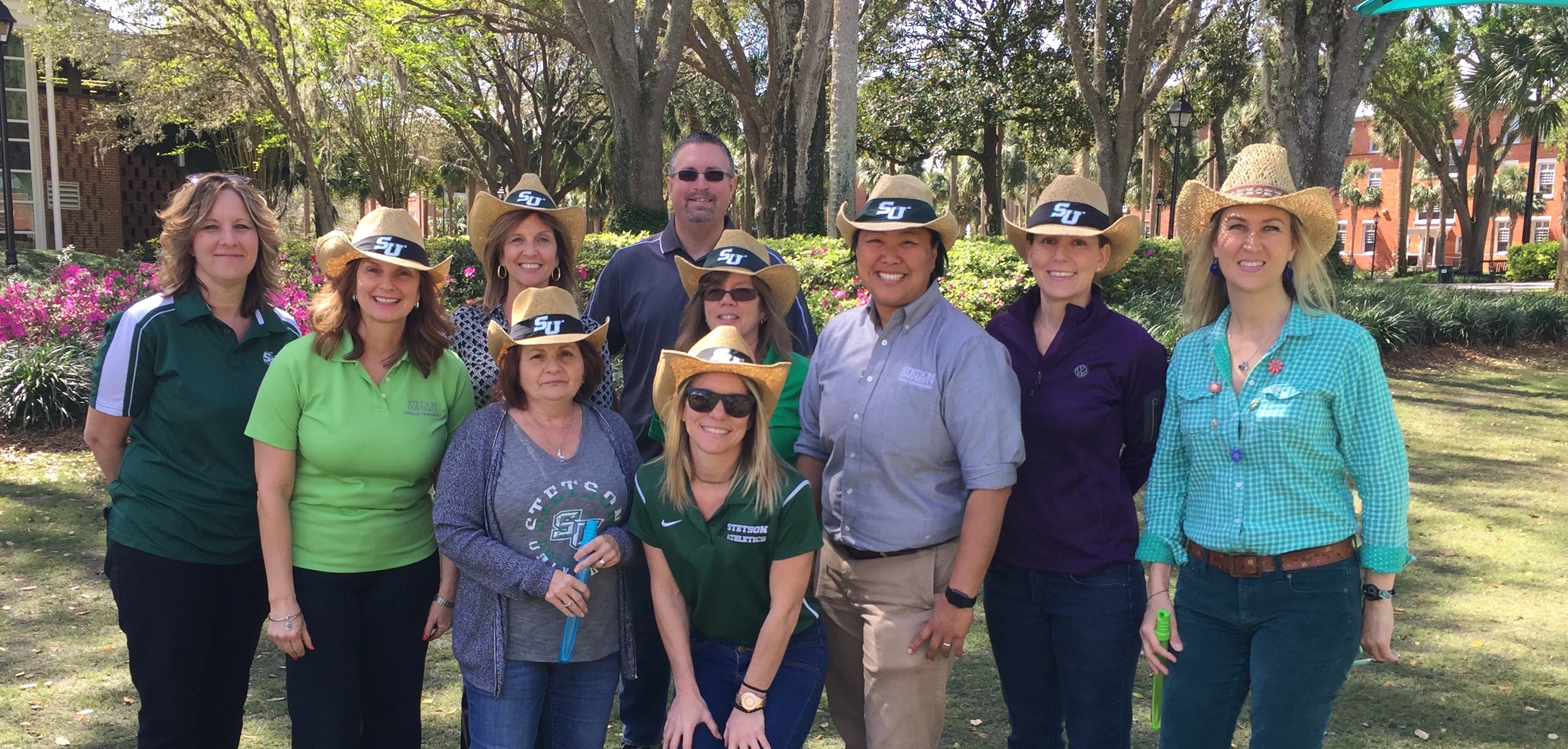 All council members wearing Stetson hats and smiling