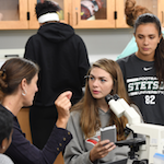 Students in classroom interacting with each other