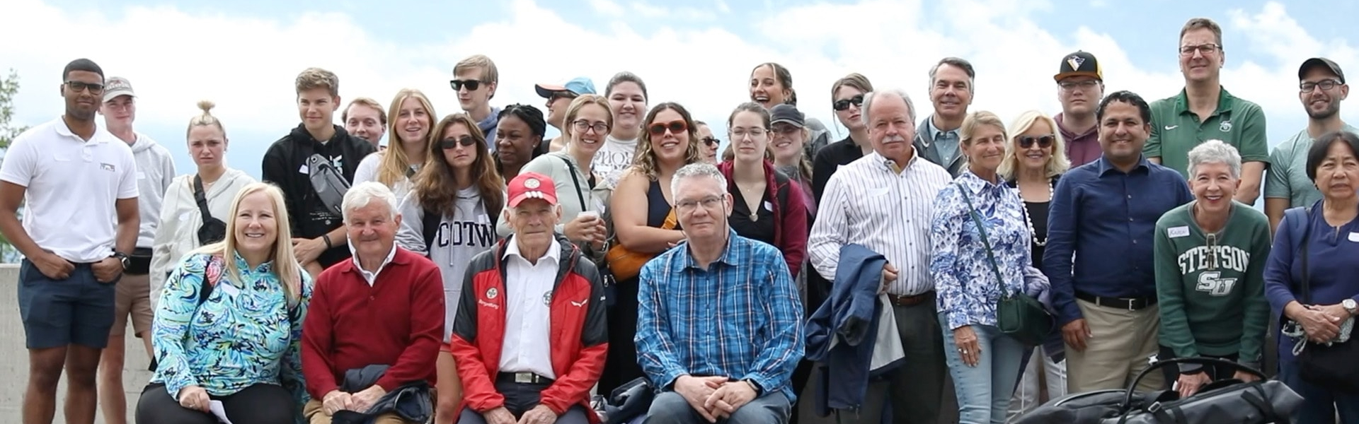 group of alumni, staff and students group picture during trip