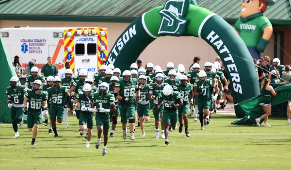 Stetson Hatters running out to the football field