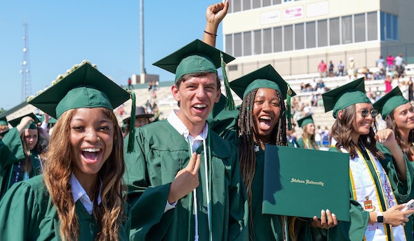 Stetson graduates cheering at the graduation ceremony