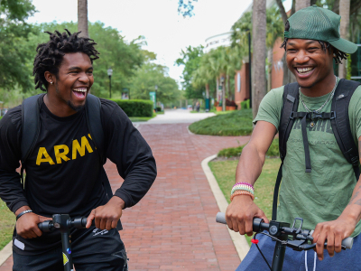 2 students laughing outside