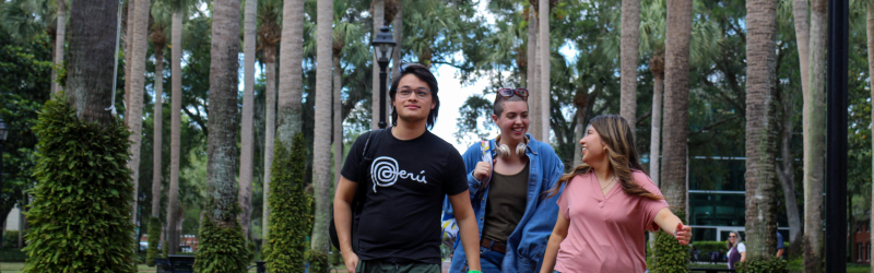 student walking outside on campus