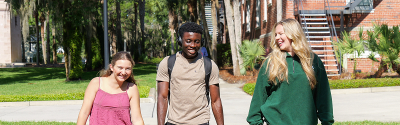 students on campus walking outside