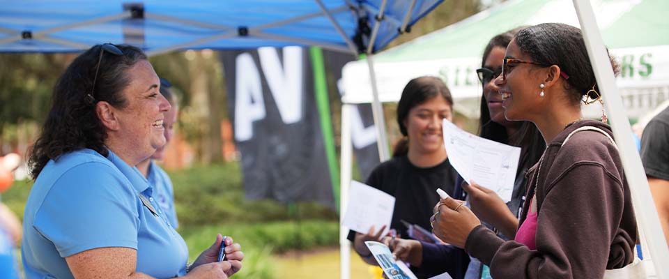 student talking excitedly with community partner