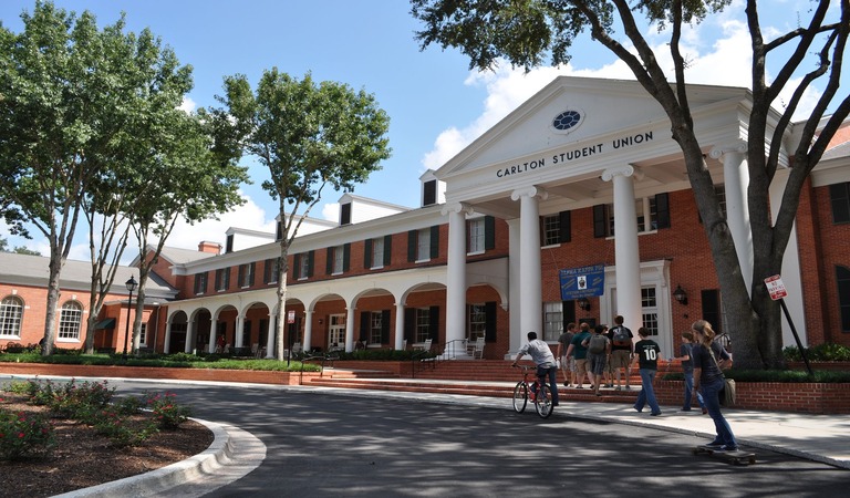 Students walking up to Carlton Union building