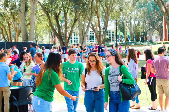 Gathering of Stetson students at exposition tables