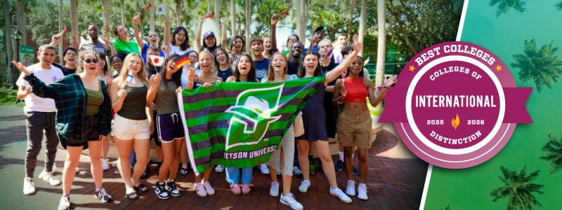 international students group picture next to colleges of distinction badge