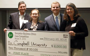 Group photo of the Templetons with two students winners and their check in the Business Case competition.