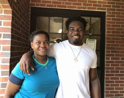 C.J. Davis poses with his mother outside his residence hall.