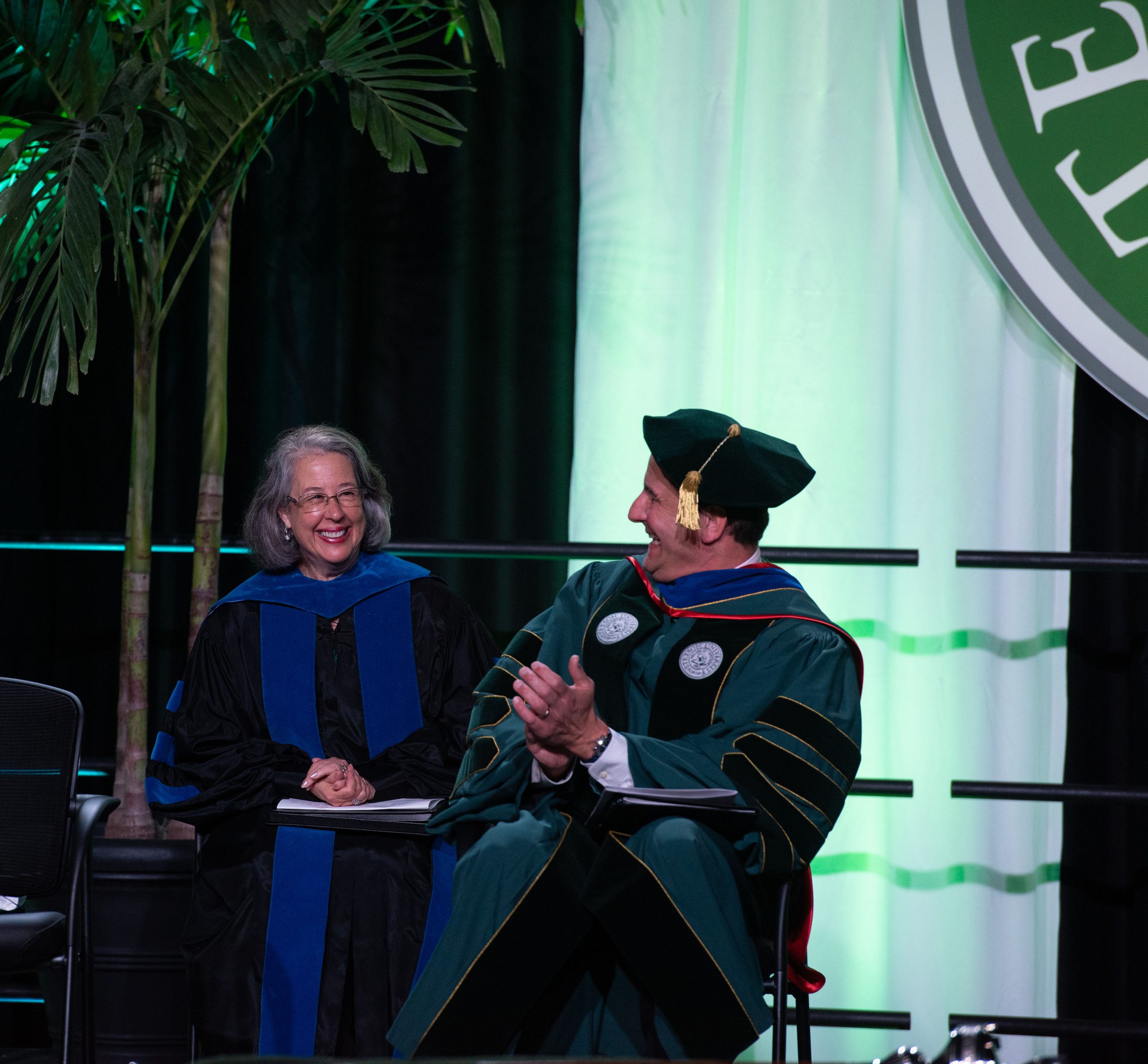President Roellke and President Emerita Wendy Libby share a laugh on stage.